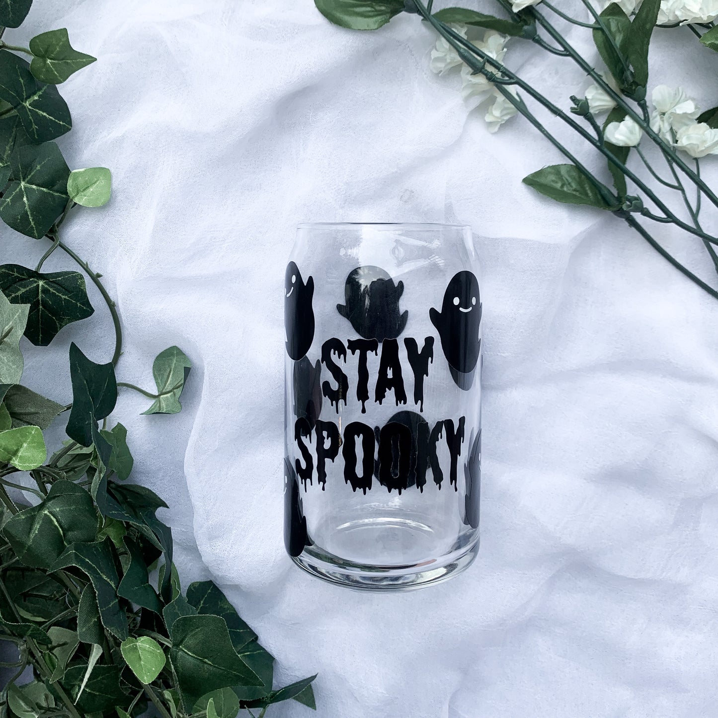 Spooky season glass covered in cute spooky ghosts.