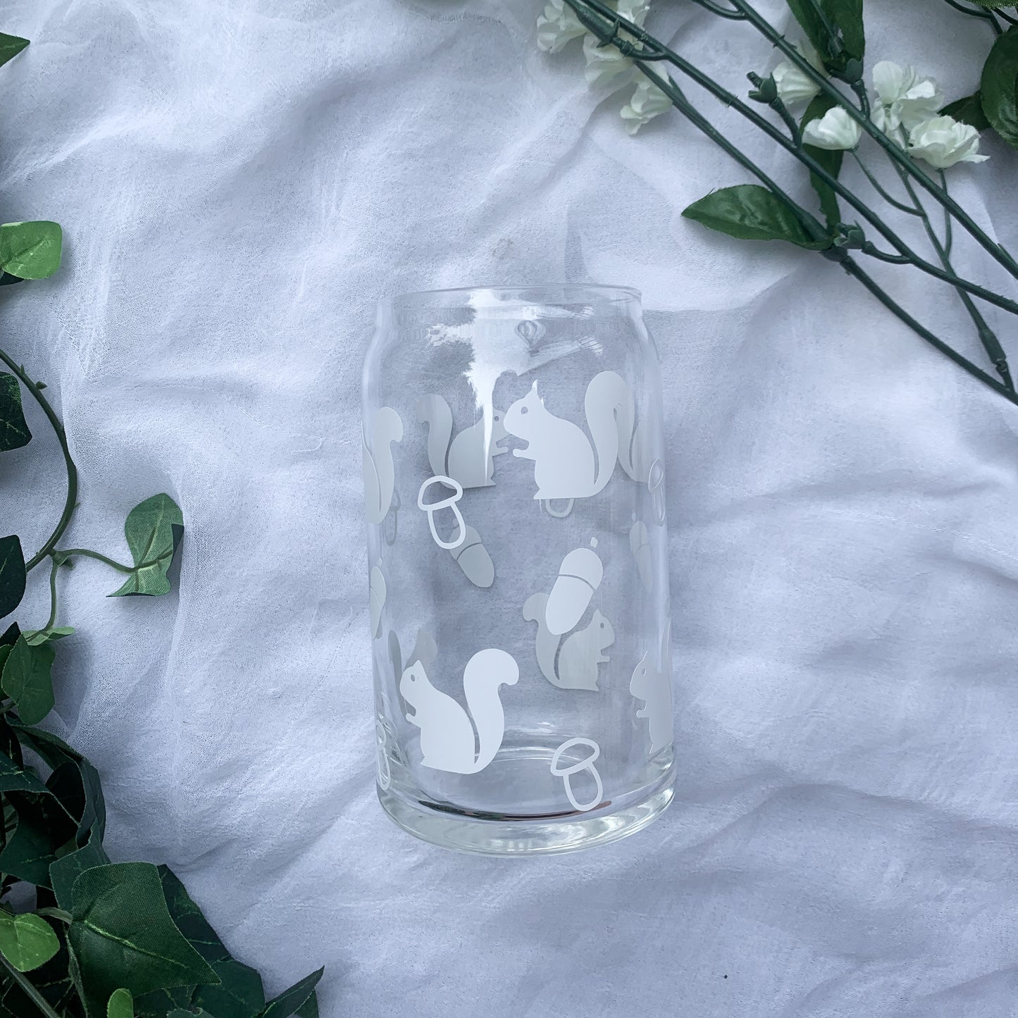An adorable glass can with cottagecore aesthetics is perfect for iced coffee.