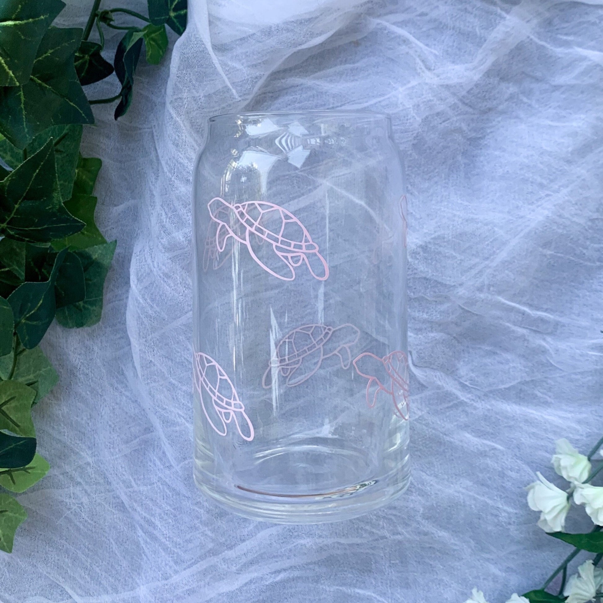 Clear glass with delicate sea turtle line work on it. 