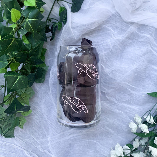 Cute sea turtle glass can with baby pink sea turtles.